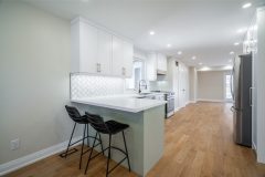 kitchen-with-bar-island-and-chairs-1536x1024