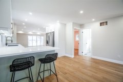 chic-kitchen-with-bar-island-and-chairs