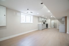high-end-basement-kitchen-design-with-built-in-appliances