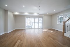modern-living-room-with-hardwood-floor-and-pot-lights