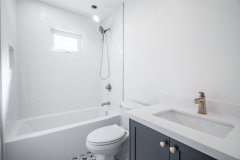 modern-white-bathroom-design-with-chrome-fixtures