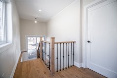 wood-staircase-with-metal-balusters