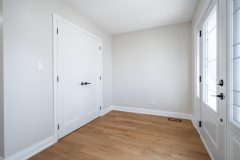 bright-master-bedroom-with-wht-french-door-and-hardwood-floors-1536x1024