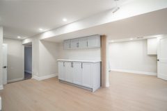 chic-basement-living-space-with-grey-cabinets-1536x1024