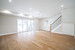 modern-living-space-with-white-walls-hardwood-floor-and-pot-lights-1536x1024