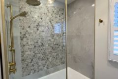 bathtub-with-gold-shower-fixtures-450x600