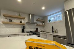 basement-kitchen-with-open-shelves-and-pot-lights