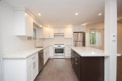 modern-kitchen-with-white-cabinets-and-marble-countertops-1536x1018
