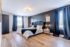 modern-bedroom-with-white-and-grey-walls-and-grey-curtains