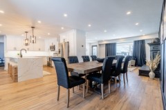 dining-room-with-wooden-table-and-dark-grey-leather-chairs