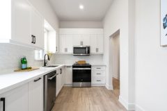 posh-kitchen-white-cabinets-with-built-in-appliances-1536x1024